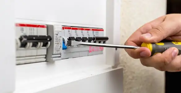 electrical panel upgrade service showing technician adjusting circuit breakers during system upgrade in San Francisco, CA