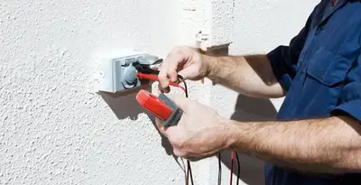 Electrician performing home electrical outlet and wiring inspection in San Francisco, CA