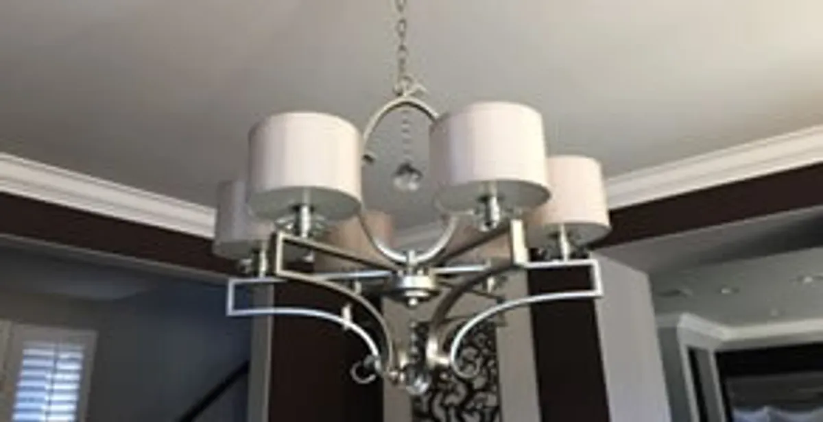 Modern chandelier installation with multiple light fixtures in San Francisco, CA