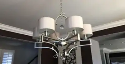 Modern chandelier installation with multiple light fixtures in San Francisco, CA