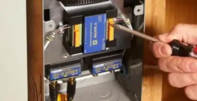 Whole home surge protection device being installed by a licensed electrician to protect electrical systems in San Francisco, CA
